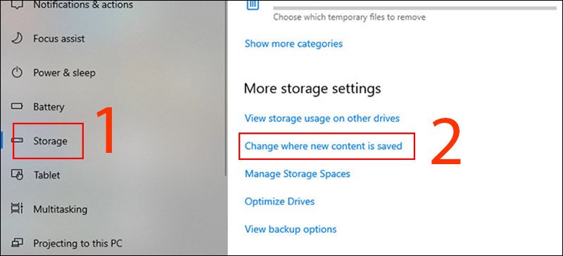 Chọn Change where new content is saved ở tab Storage
